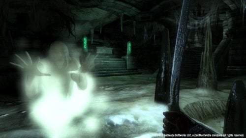 Screenshot from The Elder Scrolls IV: Oblivion video game showing a first-person perspective of a character holding a sword, with a ghostly apparition in an underground dungeon-like setting.