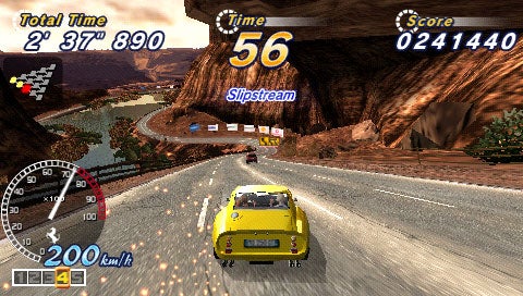 Screenshot of OutRun 2006: Coast 2 Coast video game showing yellow sports car racing on a desert canyon road with game HUD displaying total time, remaining time, and score.