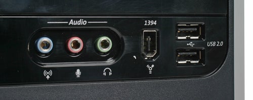 Close-up of the front panel on a Compaq Presario SR1719UK desktop computer showing audio input/output jacks, a FireWire (IEEE 1394) port, and two USB 2.0 ports.