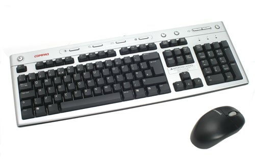 Compaq Presario keyboard and mouse set on a white background.