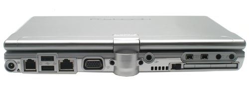 A Dialogue Flybook convertible laptop closed, showing the back side with various ports including USB, VGA, Ethernet, modem, and audio connections.