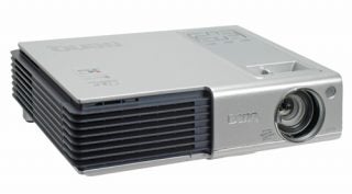 Compact BenQ CP120 wireless projector with silver casing and lens visible on the left side.
