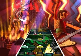 Screenshot from Guitar Hero video game showing a player character with a guitar on a virtual stage with colorful graphics and the game's signature guitar fret interface with notes to hit.