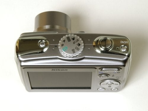 Nikon Coolpix P4 digital camera shown from the top with control dials, buttons, and branding visible against a plain background.