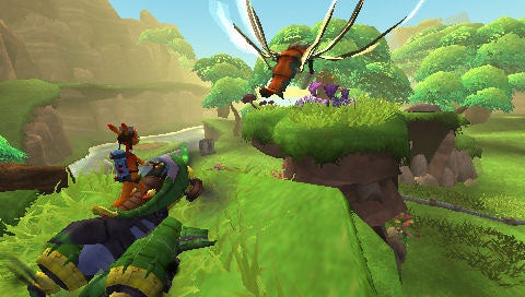 Screenshot from the video game featuring characters Daxter and Jak in a lush green environment with Jak riding a large bug-like creature and Daxter flying in the air with a propeller attached to his back.
