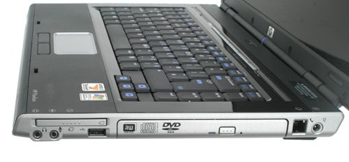 A close-up view of the left side of an HP Pavilion dv5046EA laptop showing ports and DVD drive.