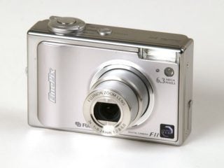 Silver Fujifilm Finepix F11 digital camera with 6.3 megapixels and Fujinon zoom lens displayed on a white background.