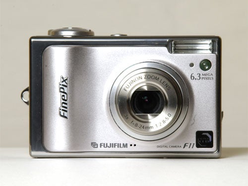 Fujifilm Finepix F11 digital camera placed on a neutral background, showcasing its silver body, lens, and the 6.3 megapixels label.