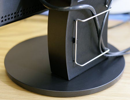 Close-up of the Eizo FlexScan S2410W monitor stand showing the cable management feature.