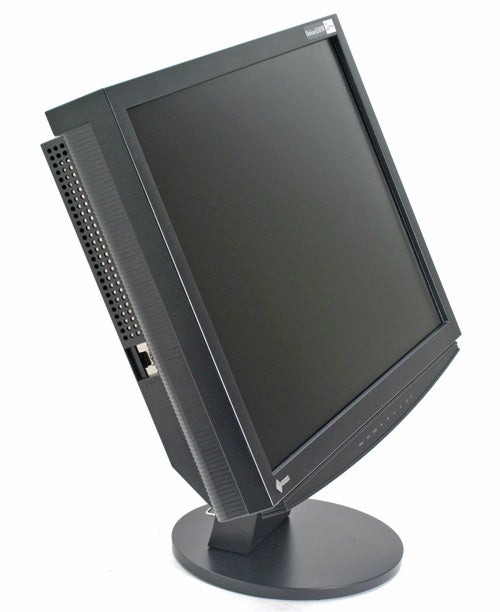 Eizo FlexScan S2410W LCD monitor on a swivel stand with a black bezel, power and adjustment buttons on the front lower edge, and ventilation grille on the side.