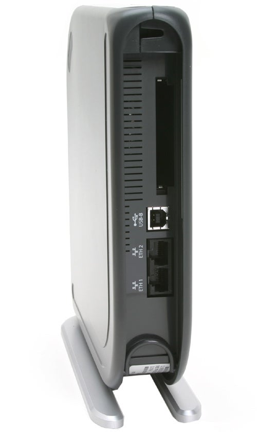 Vertical image of a BT Fusion broadband router in an upright standing position displaying its rear panel with various ports including an ADSL port, Ethernet ports, and power supply socket.