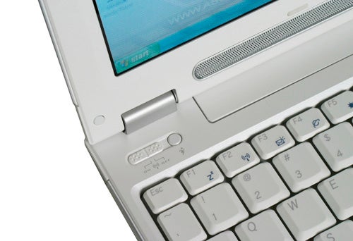 Close-up of an Asus W5F Core Duo Notebook keyboard and part of the screen displaying the Windows start screen, highlighting the compact design and build quality.