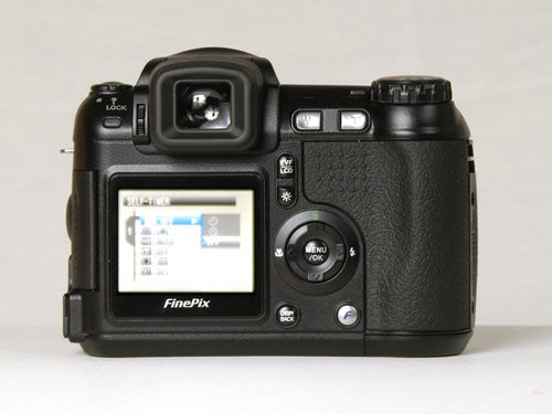 Fujifilm FinePix S5600 digital camera displayed from the back showing the LCD screen, viewfinder, and control buttons.