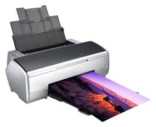 Epson Stylus Photo R2400 inkjet printer with a high-quality color landscape printout emerging from the front tray.