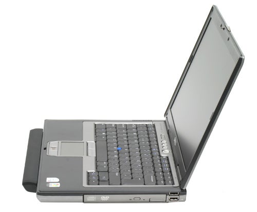 Dell Latitude D620 laptop with the screen open, showing keyboard and touchpad, with the DVD drive visible on the side.