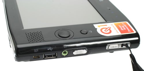 Close-up of a Samsung Q1 Ultra Mobile PC's side I/O ports showing USB, headphone jack, and power connector.