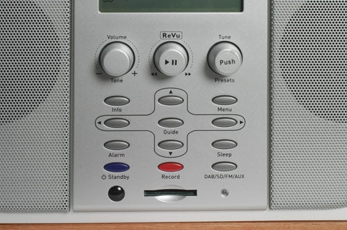 Close-up of the control panel on the Pure Evoke-3 digital radio, showing volume knobs, function buttons, and record features.