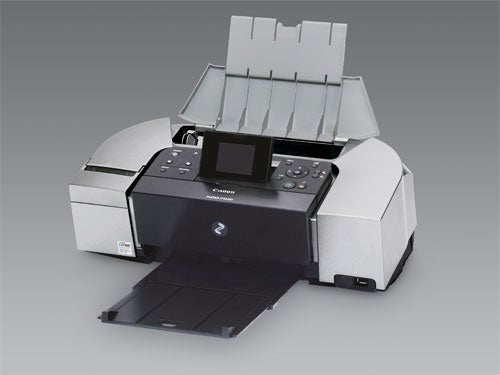 Canon PIXMA iP6220D printer with output tray extended and control panel visible on a gray background.