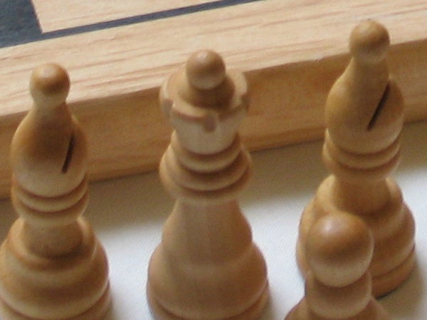 Close-up photo of chess pieces on a board showcasing the depth of field and clarity captured by the Canon PowerShot A540 camera.