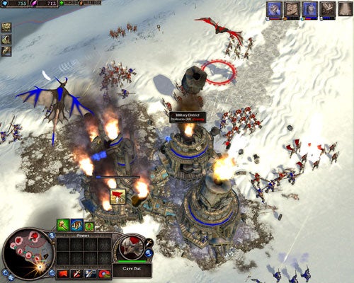 Screenshot of a gameplay scene from the video game Rise of Legends showing an overhead view of a snowy battlefield with various fantasy units in combat, a burning building, and the game's user interface elements.