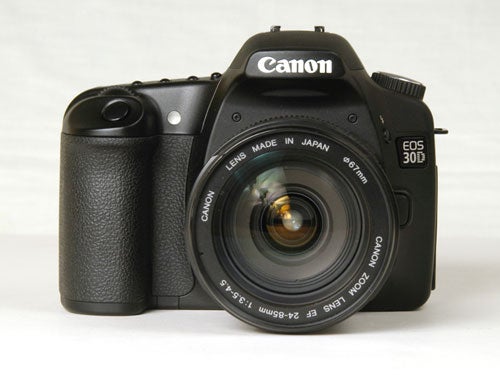 Canon EOS 30D Digital SLR camera with a zoom lens attached, placed on a white background.