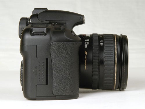 Canon EOS 30D Digital SLR camera with black body and attached lens displayed on a light background.