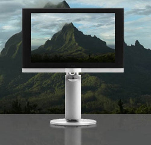 B&O BeoVision 7-40 40-inch LCD TV displayed on a stand with a mountain landscape on the screen, showcasing the television's design and picture quality.