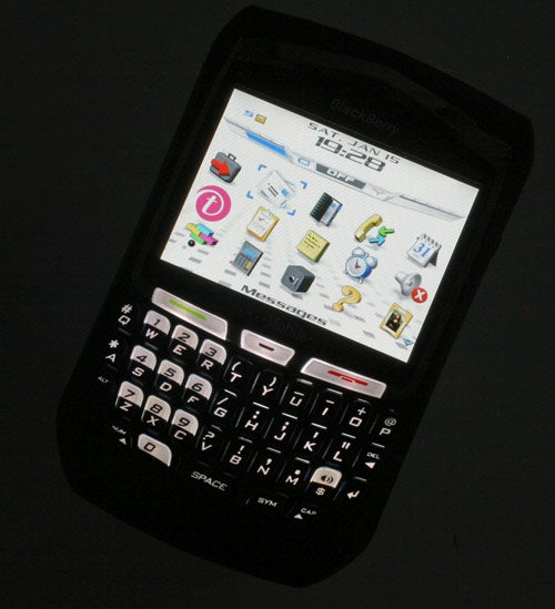 BlackBerry 8700 smartphone with a QWERTY keyboard and a colorful display screen showing application icons.