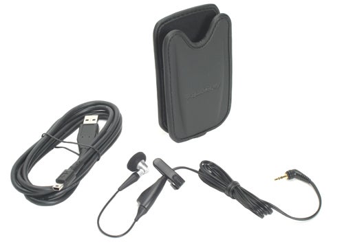 BlackBerry 8700 accessories including a USB cable, earphones with microphone, and a leather pouch.