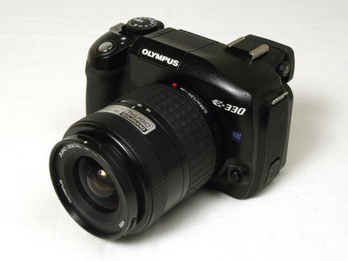 Olympus E-330 digital SLR camera with a standard zoom lens on a white background.