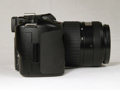 Olympus E-330 Digital SLR camera with a black lens attached, displayed against a neutral background.