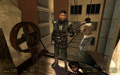 Screenshot from the video game Half-Life 2: Episode One showing two characters, one male in the foreground holding a gun and a female in the background, in a rundown building environment with a health and suit power HUD displayed.