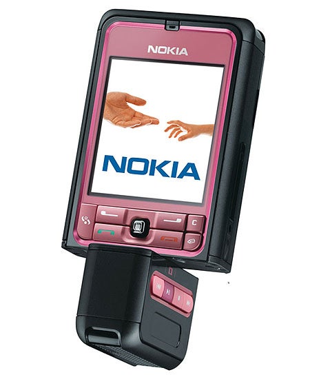 Nokia 3250 mobile phone in pink with a twistable keypad section, displaying the Nokia logo on its screen.