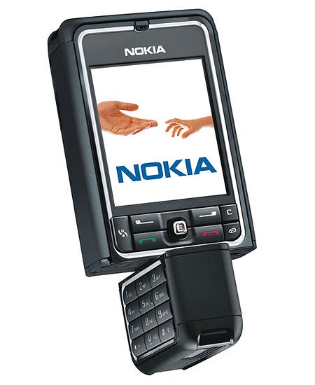 Nokia 3250 mobile phone with twist design showing its screen and alphanumeric keypad. The screen displays the Nokia logo and an image of two hands reaching towards each other.