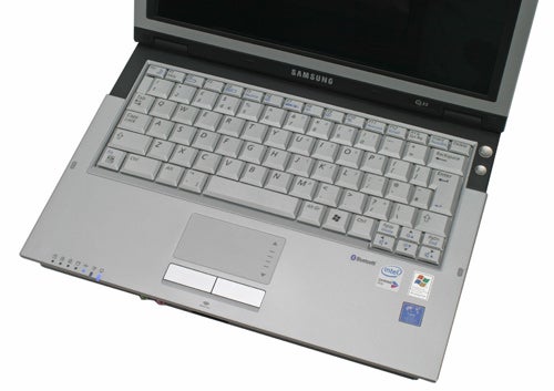 Samsung Q35 ultra-portable notebook open on a desk showing the keyboard, trackpad, and part of the screen with branding and Intel sticker visible.