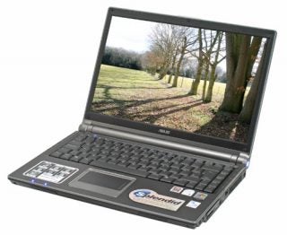 Asus W3J 14-inch Dual-Core Notebook open and powered on, displayed outdoors with trees and a clear sky in the background, showcasing its design and stickers indicating Windows and Intel Centrino Duo technology.