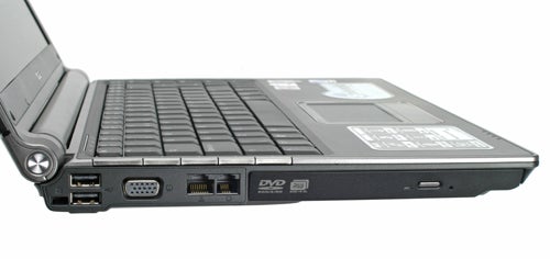 Asus W3J 14-inch dual-core notebook with its screen partially open, showcasing the left side ports including VGA, USB, and DVD drive.
