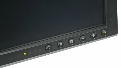 Close-up view of Dell Ultrasharp 2407WFP 24-inch Widescreen monitor's control panel, showing power button and adjustment keys.