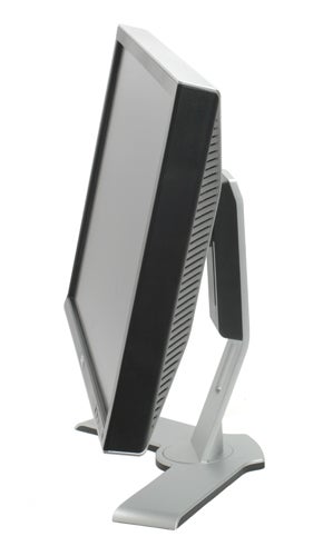 Side view of a Dell Ultrasharp 2407WFP 24-inch widescreen monitor, highlighting its adjustable stand and thin profile.