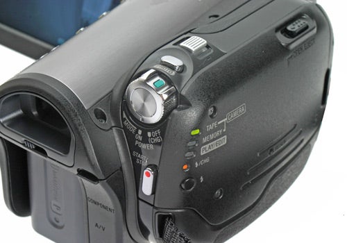 Close-up of a Sony HDR-HC3E HD Camcorder showing control buttons and switches with detail on its side panel.