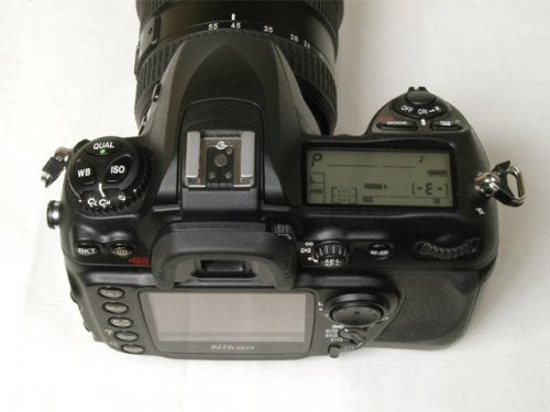 Nikon D200 digital SLR camera seen from above showing the lens, top LCD panel, and control buttons.