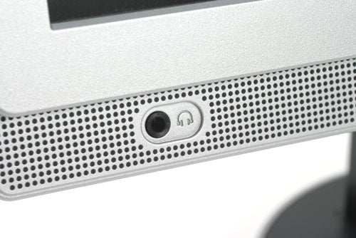 Close-up of the Samsung SyncMaster 215TW monitor's built-in speaker grille and headphone jack.