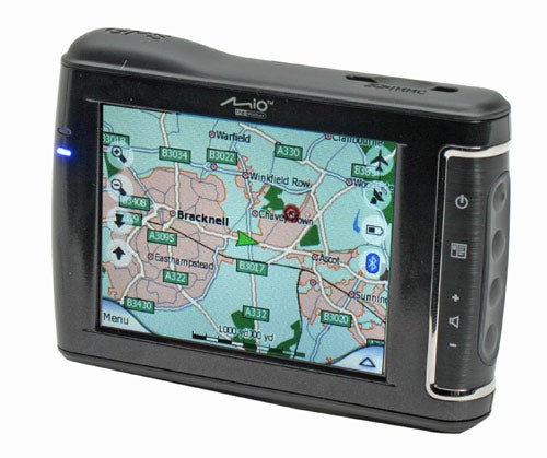 Mio DigiWalker C710 portable GPS navigation device with a visible map on the screen showing roads and locations.