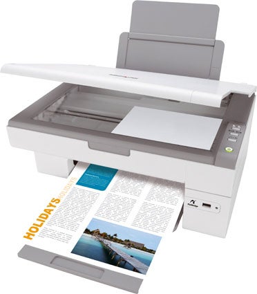 Lexmark X2470 printer with an open output tray and a colorful document featuring text and a landscape image being printed.