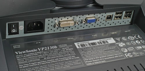 Rear connectivity panel of a Viewsonic VP2130b monitor, displaying various ports including DVI, VGA, power socket, and USB, alongside product information label.