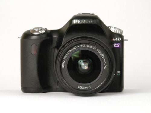 Front view of a Pentax *ist DL2 Digital SLR camera with a smc Pentax-DA 1:3.5-5.6 18-55mm AL lens attached.