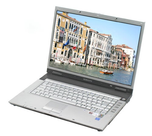 Samsung X60 Centrino Duo Notebook open on a white surface displaying a vibrant wallpaper of a Venetian canal scene with buildings and boats.