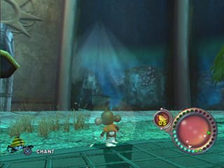 Screenshot from the video game Super Monkey Ball Adventure showing a character inside a transparent ball in a mystical temple environment with a chant mechanic indicated by the 'X' button prompt and a circular radar on the right side of the screen.