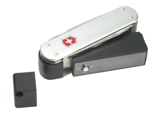 SwissBit s.beat MP3 digital audio player designed like a Swiss Army knife with USB connector and earphone jack visible.