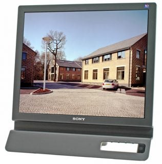 Sony SDM-E96D 19-inch LCD monitor displaying a street scene image, with the brand logo visible at the bottom bezel.